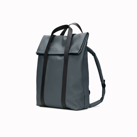 The Rains 2 Way Tote Backpack is characterised by a fold-top opening with the addition signature TPU strap details with top handles.