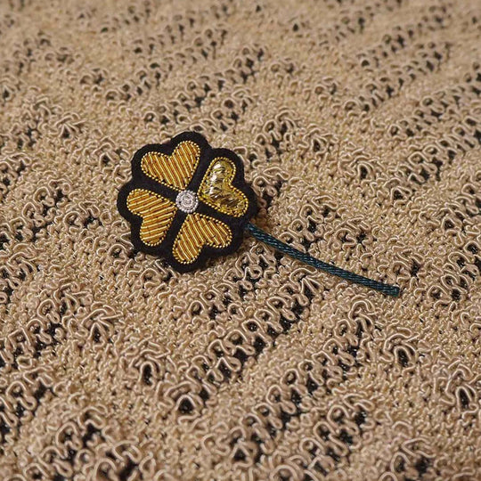Hand-embroidered 4 Chances lapel pin by Parisian fashion accessory brand Macon et Lesquoy. Measuring approximately 25mm by 25mm, the Light Heart is part of their 'Rock like an Egyptian' Collection.
