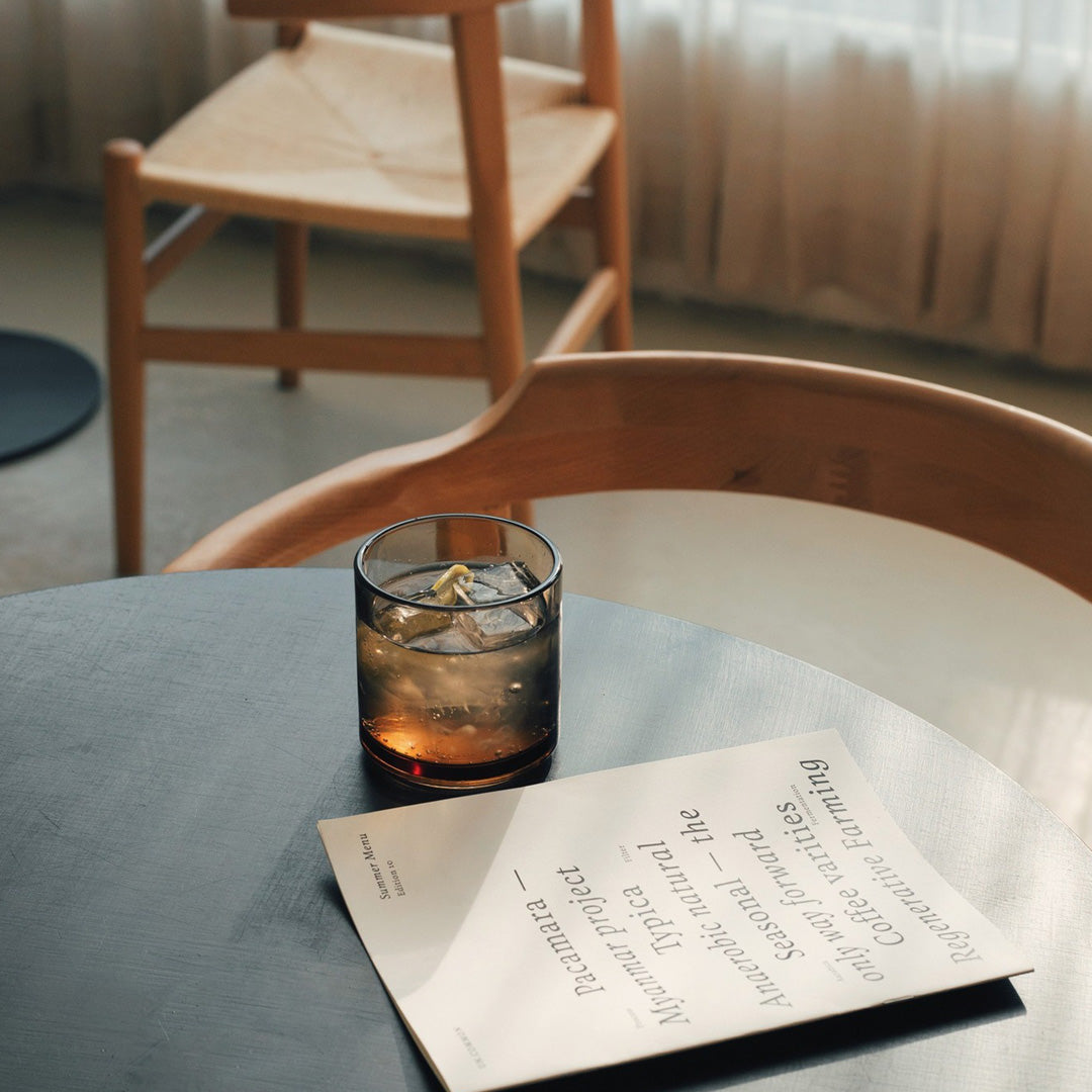 Amber glass tumbler by Hasami Porcelain is a stackable glass with clean lines and a minimalist feel.  Lifestyle Image