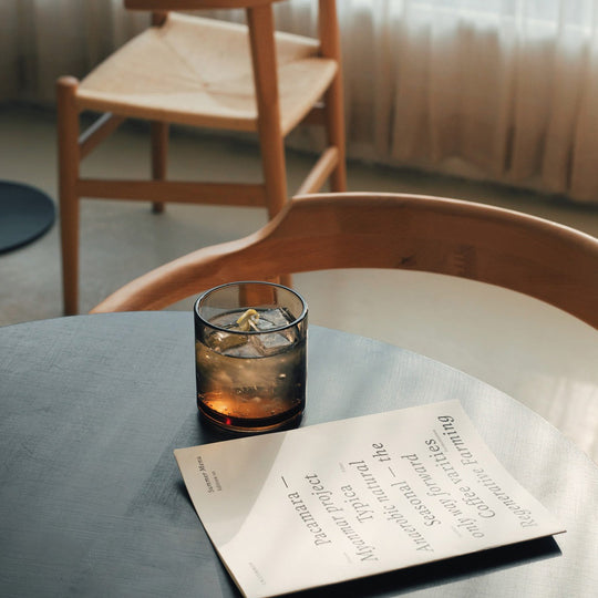 Amber glass tumbler by Hasami Porcelain is a stackable glass with clean lines and a minimalist feel.  Lifestyle Image