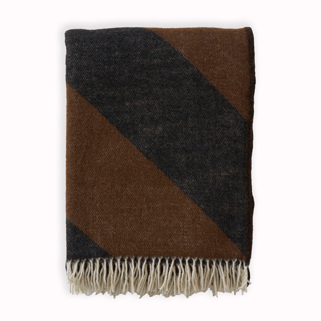 The Angle Cocoa throw from Klippan is a luxurious and environmentally friendly choice for those looking to add comfort and style to their home.
