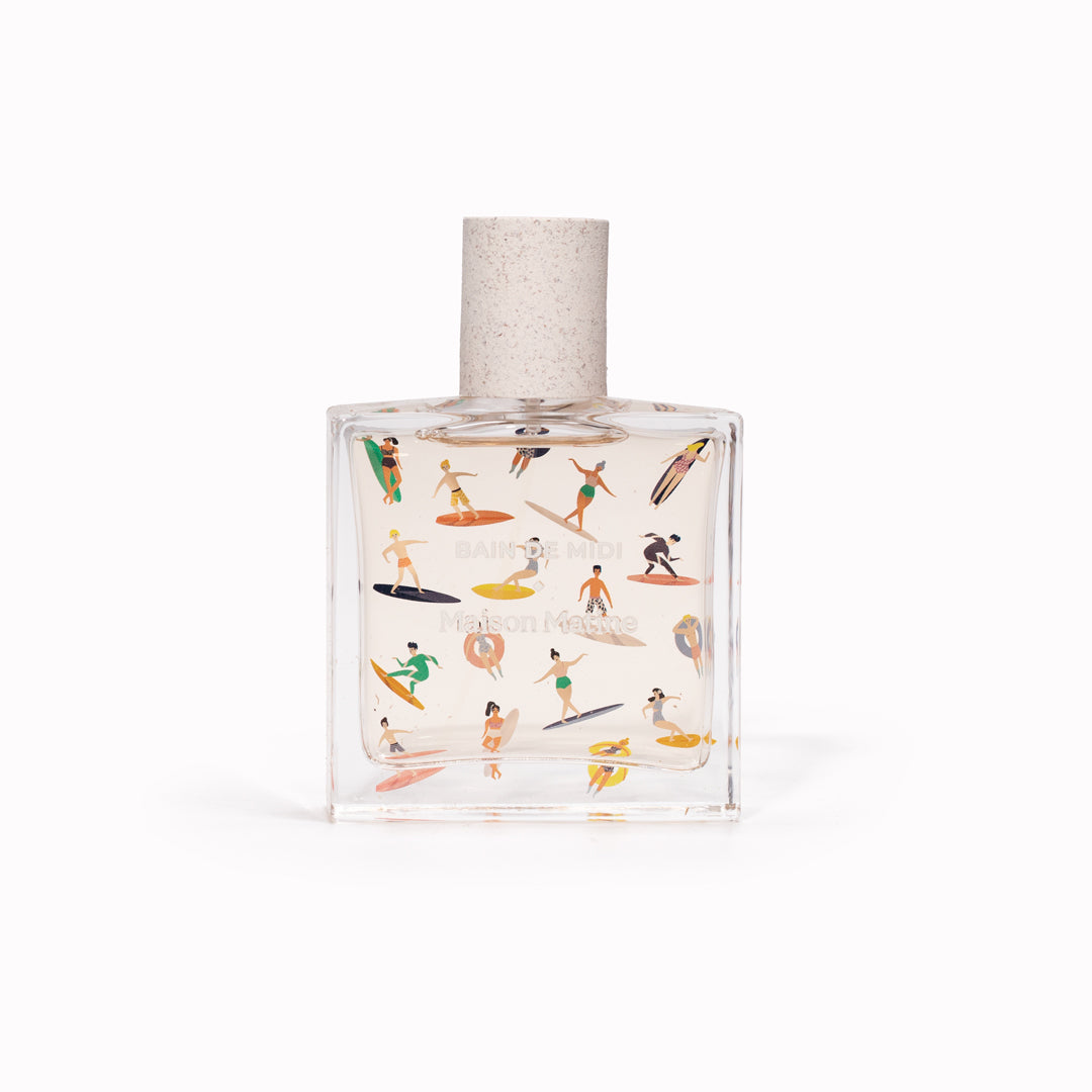 Bain de Midi 50ml bottle, illustrated with pastel surfers. Maison Matine's 'Bain de Midi' is a scent inspired by lightness, simplicity, summer and the joy of being alive, all housed in an illustrative glass bottle. The name means 'midday bath,' an unexpected time for joy and relaxation. The smell of holidays in the sun.
