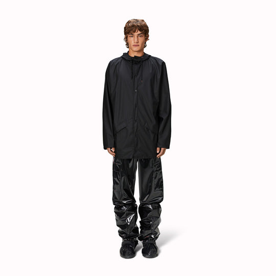 Contemporary unisex rain jacket from Danish Outerwear and Lifestyle company Rains. This black jacket is characterized by a minimal silhouette with high functionality.