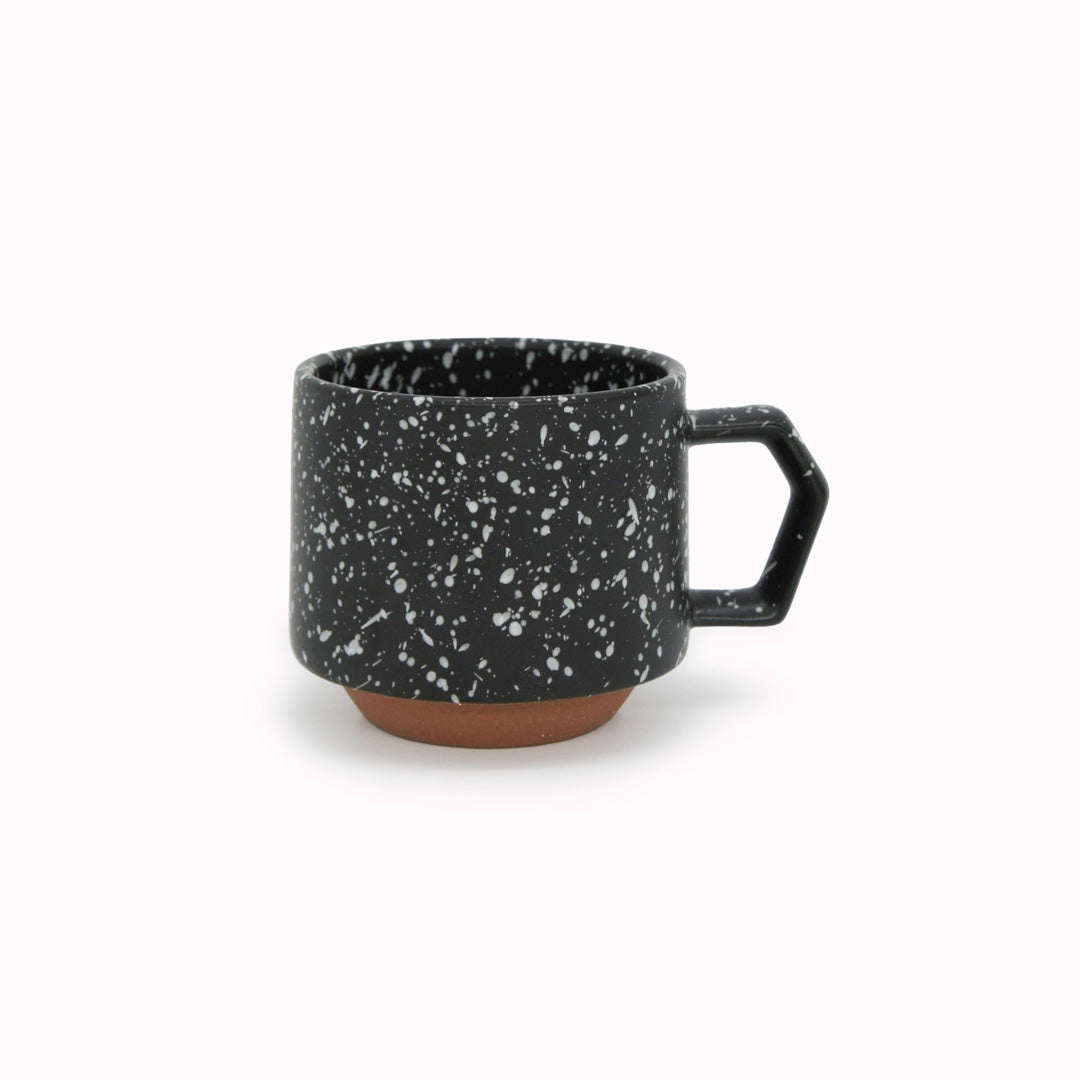 Compact and Easy to hold and stackable for easy storage. This Splash mug has a white glaze playfully sprayed over black with an unglazed base. They are sturdy and comfortable to hold with a unique silhouette.