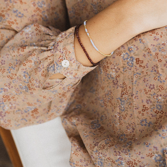 The Tan Line Deep Burgundy bracelet by Anni Lu is a vibrant and playful piece, reflecting the latest fashion colour trends.