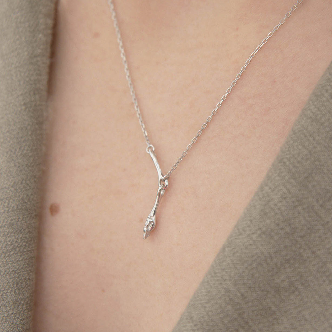 As Worn. Carrion necklace from Maria Black, a bold and captivating statement piece that elevates your style.