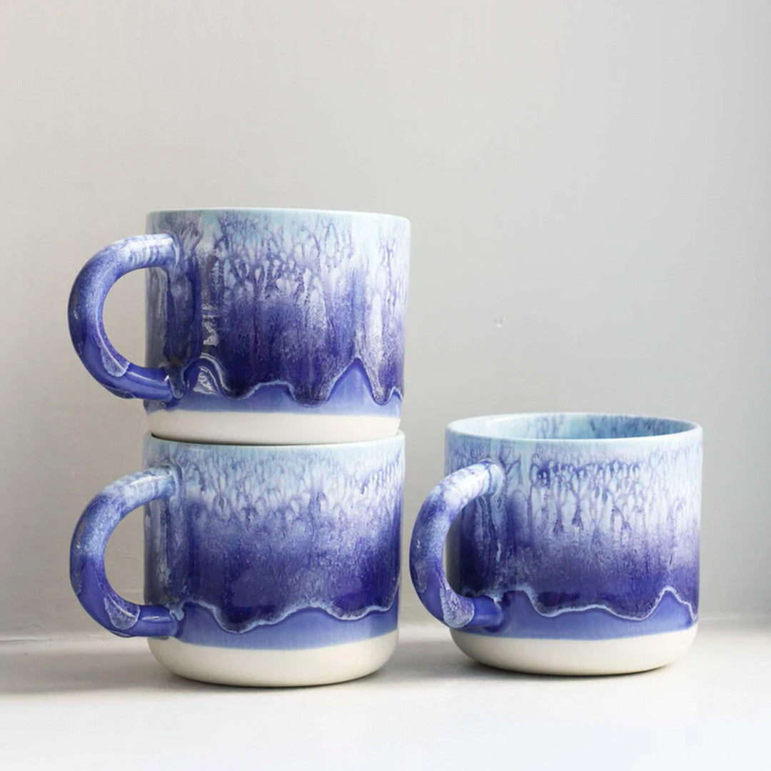 Blue over White heavy glazed, Japanese inspired ceramic mug from Studio Arhoj. The Chug Mug features their trademark thick, hand poured coloured glaze which means that each mug is unique.