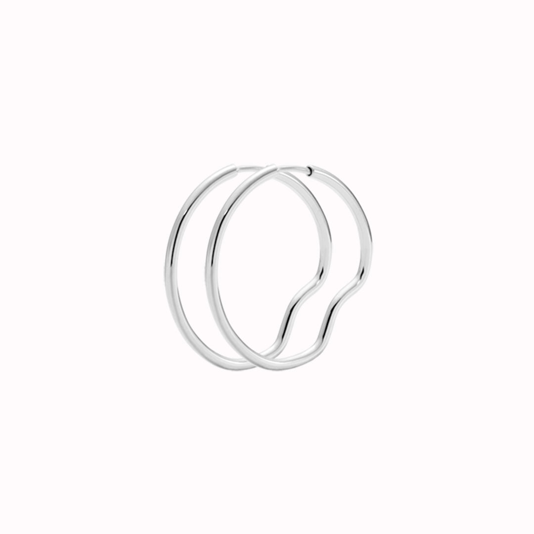 Silver Hoop - This hoop features a bend placed north, south, east and west, representing Copenhagen the city they were designed in.