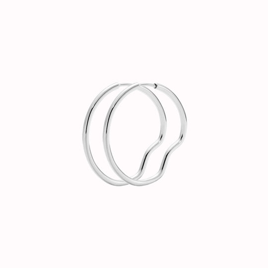 Silver Hoop - This hoop features a bend placed north, south, east and west, representing Copenhagen the city they were designed in.