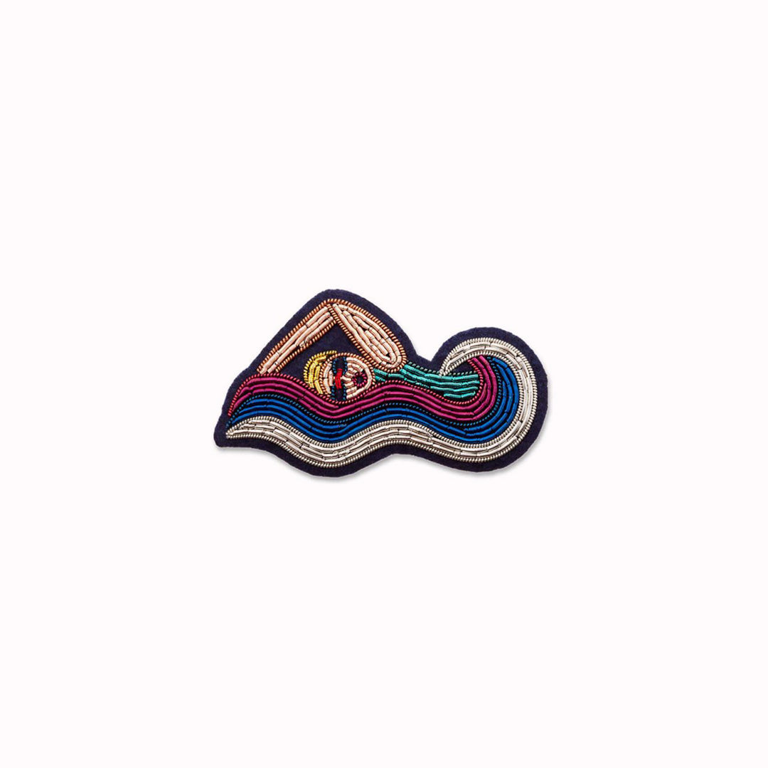 Make a splash! Statement piece brooch from the Macon et Lesquoy summer 2024 collection, inspired by the 2024 Paris Olympics. Swimming themed hand embroidered decorative lapel pin - personalise your favourite garments to define your individual style.