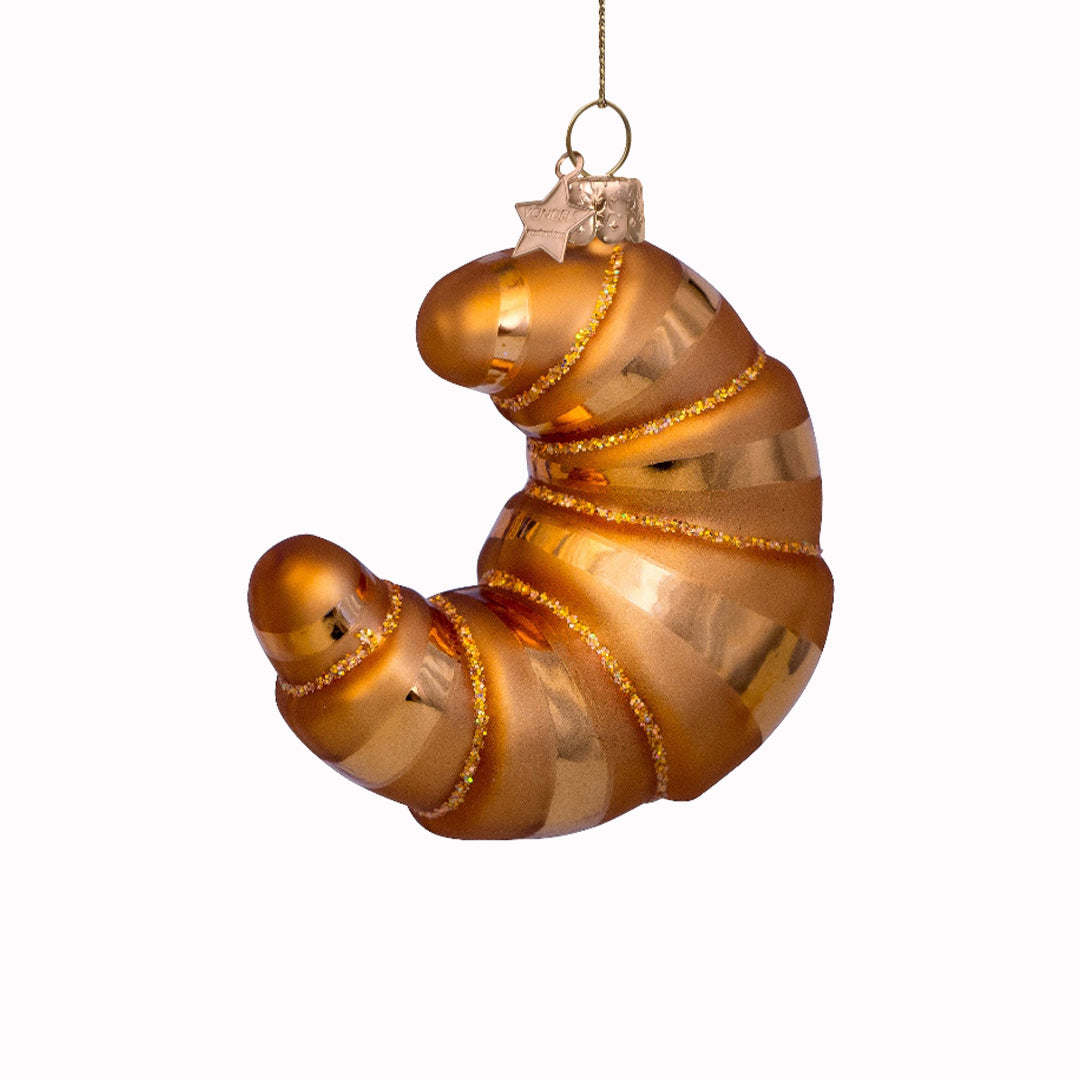 Inject some sparkly fun into your Christmas tree with this hand painted and mouth blown glass Croissant ornamental Christmas tree decoration by Vondels.