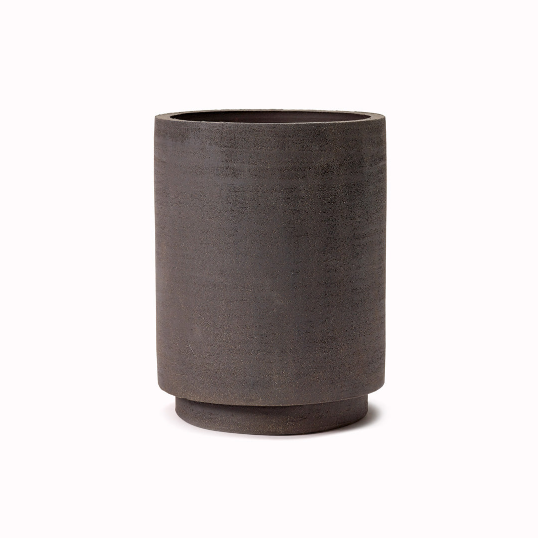 The Cylinder Pot from Serax is a beautifully crafted piece from terracotta that combines functionality with a slightly rustic aesthetic feel. Its simple proportions and shape make it a stylish addition to any indoor space.