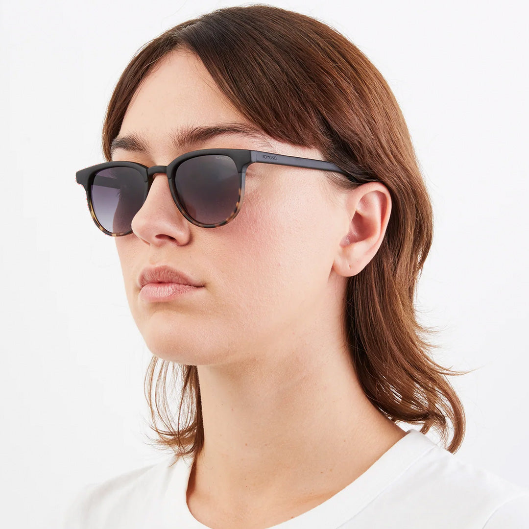 As worn by model, The Francis Black Tortoise offers unparalleled style and protection with a 139.5mm x 47.3mm Bio Nylon Frame, 100% UV400 lenses, and scratch-resistant PC lens. Featuring a frame that is matt black across the top and arms and tortoiseshell underneath paired with gradient smoke lenses, these sunglasses are both elegant and modern.