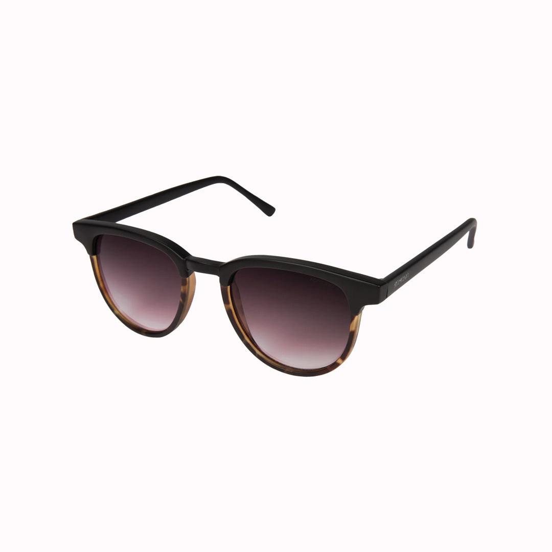 Sideways View, The Francis Black Tortoise offers unparalleled style and protection with a 139.5mm x 47.3mm Bio Nylon Frame, 100% UV400 lenses, and scratch-resistant PC lens. Featuring a frame that is matt black across the top and arms and tortoiseshell underneath paired with gradient smoke lenses, these sunglasses are both elegant and modern.