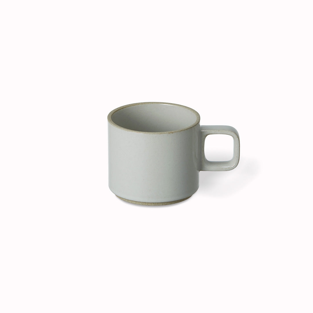 The small gloss grey porcelain mug by Hasami Porcelain is a low stackable mug for hot drinks such as green tea or coffee.