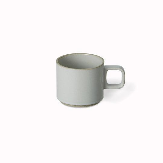 The small gloss grey porcelain mug by Hasami Porcelain is a low stackable mug for hot drinks such as green tea or coffee.