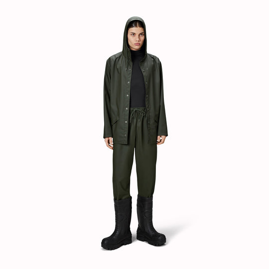 Contemporary unisex rain jacket from Danish Outerwear and Lifestyle company Rains. This green jacket is characterized by a minimal silhouette with high functionality.