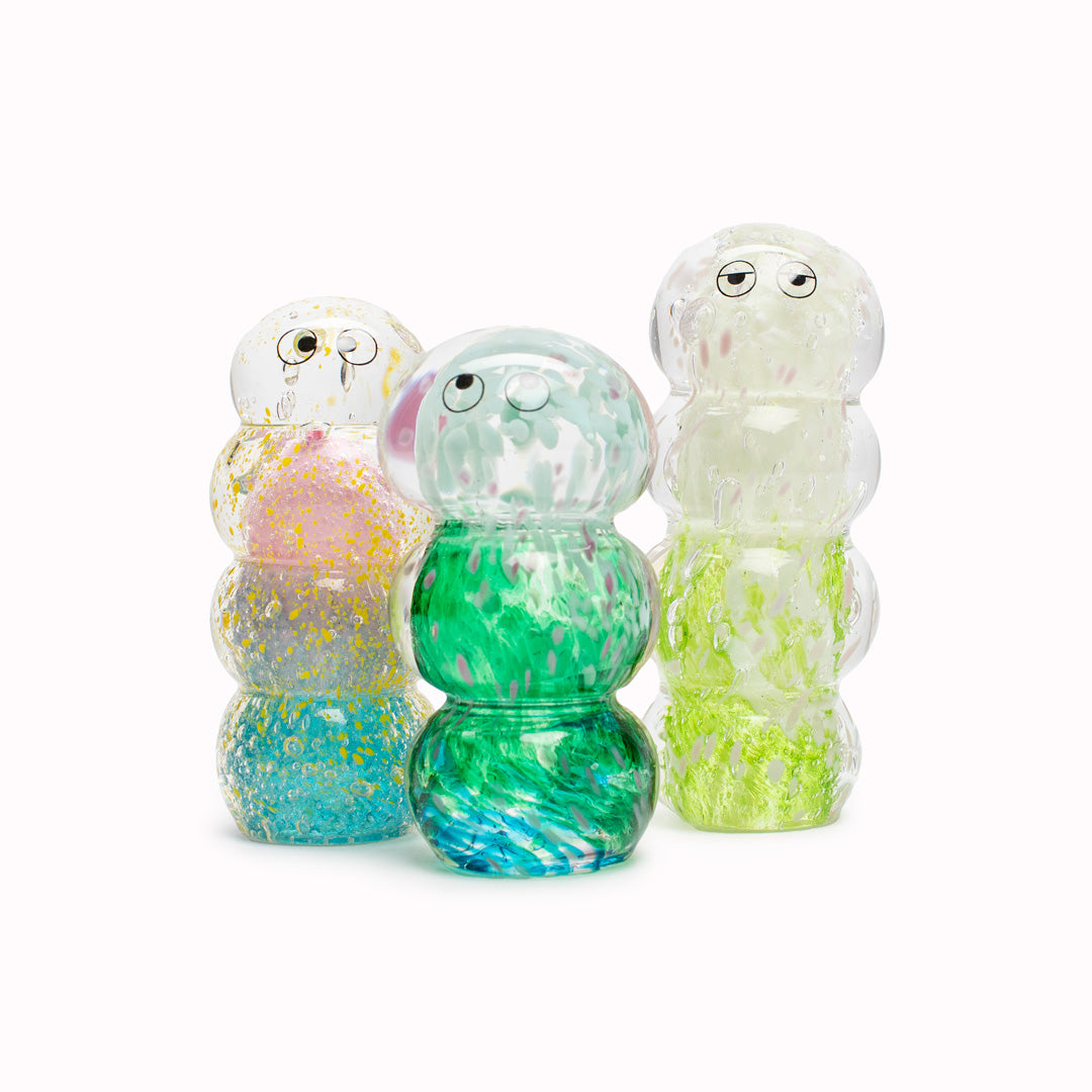 Ridge Crystal Blob is formed by dipping and/or rolling molten (hot!) clear glass into smaller chunks of brightly coloured glass droplets