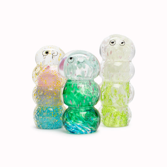 Ridge Crystal Blob is formed by dipping and/or rolling molten (hot!) clear glass into smaller chunks of brightly coloured glass droplets