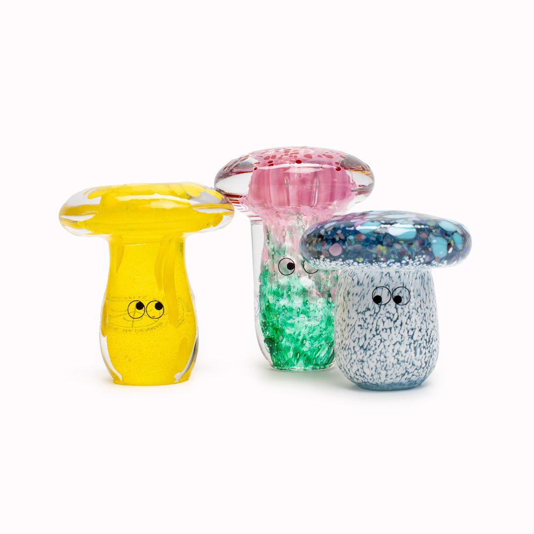 Shroom Crystal Blob is formed by dipping and/or rolling molten (hot!) clear glass into smaller chunks of brightly coloured glass droplets, then expertly shaping into weird and wonderful forms.