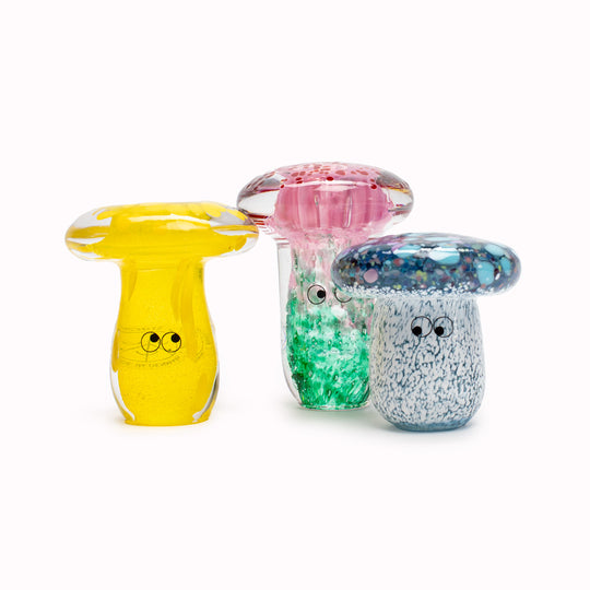 Shroom Crystal Blob is formed by dipping and/or rolling molten (hot!) clear glass into smaller chunks of brightly coloured glass droplets, then expertly shaping into weird and wonderful forms.