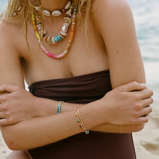 The Lagoon Bracelet by Anni Lu is a stunning piece crafted in brass with 18-karat gold plating and e-coating.