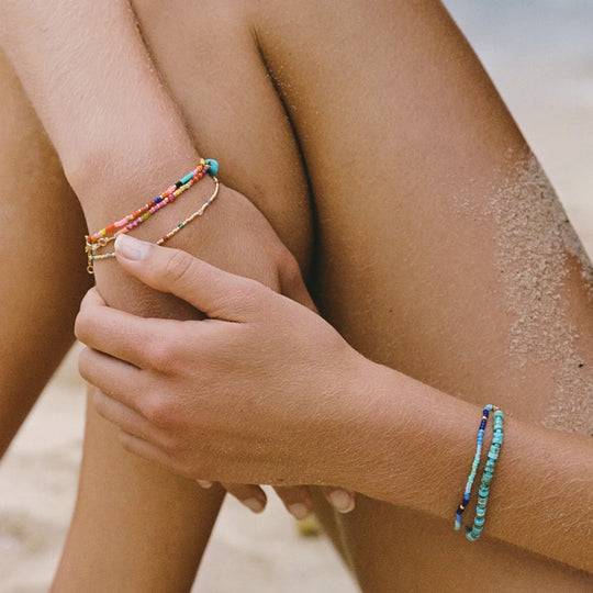 The Lagoon Bracelet by Anni Lu is a stunning piece crafted in brass with 18-karat gold plating and e-coating.