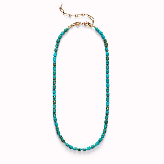Lagoon Necklace by Anni Lu is a stunning piece crafted in brass with 18-karat gold plating and e-coating. Detailed with glass beads and composite turquoise