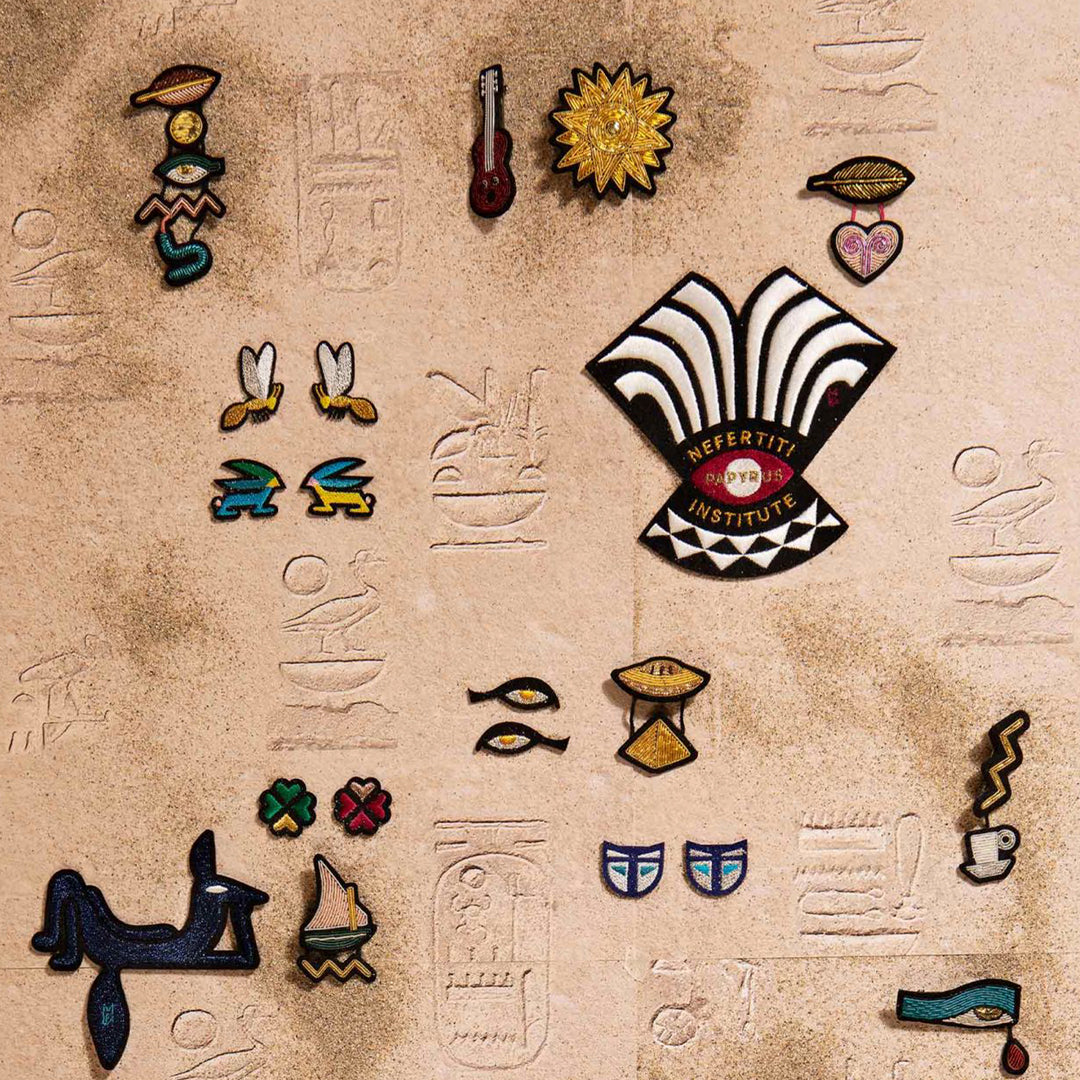 Hand-embroidered Light Heart lapel pin by Parisian fashion accessory brand Macon et Lesquoy. Measuring approximately 41mm by 46mm, the Light Heart is part of their 'Rock like an Egyptian' Collection.