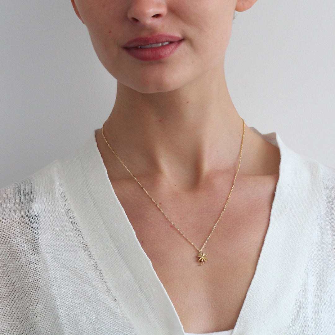 Lucky Clover is an elegant four leaf clover pendant necklace by London jeweller Alex Monroe, available in Sterling Silver or 22ct Fairmined Gold Plated silver.