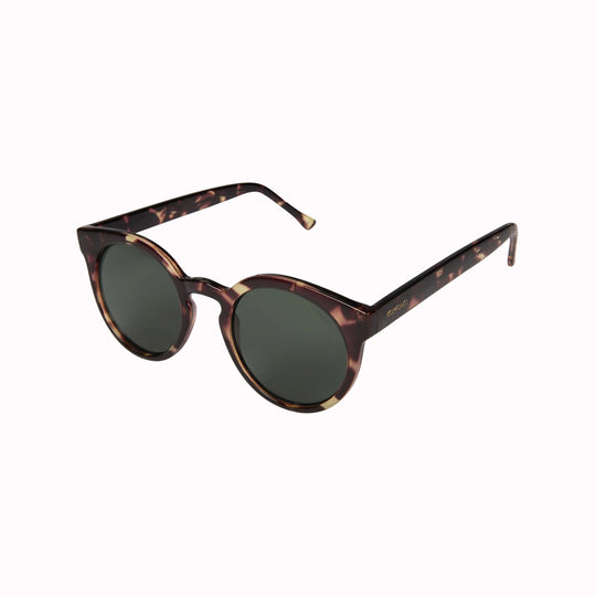 Sideways View of the Lulu featuring a unique combination of round lenses set in a cat-eye frame.  The Lulu Crystal Giraffe offers unparalleled style and protection with a 133mm x 49.4mm Bio Nylon frame, 100% UV400 lenses, and scratch-resistant PC lens. These gorgeous sunglasses feature a giraffe patterned light and dark brown Bio Nylon frame with solid dark green lenses. Quirky, chic, cool.