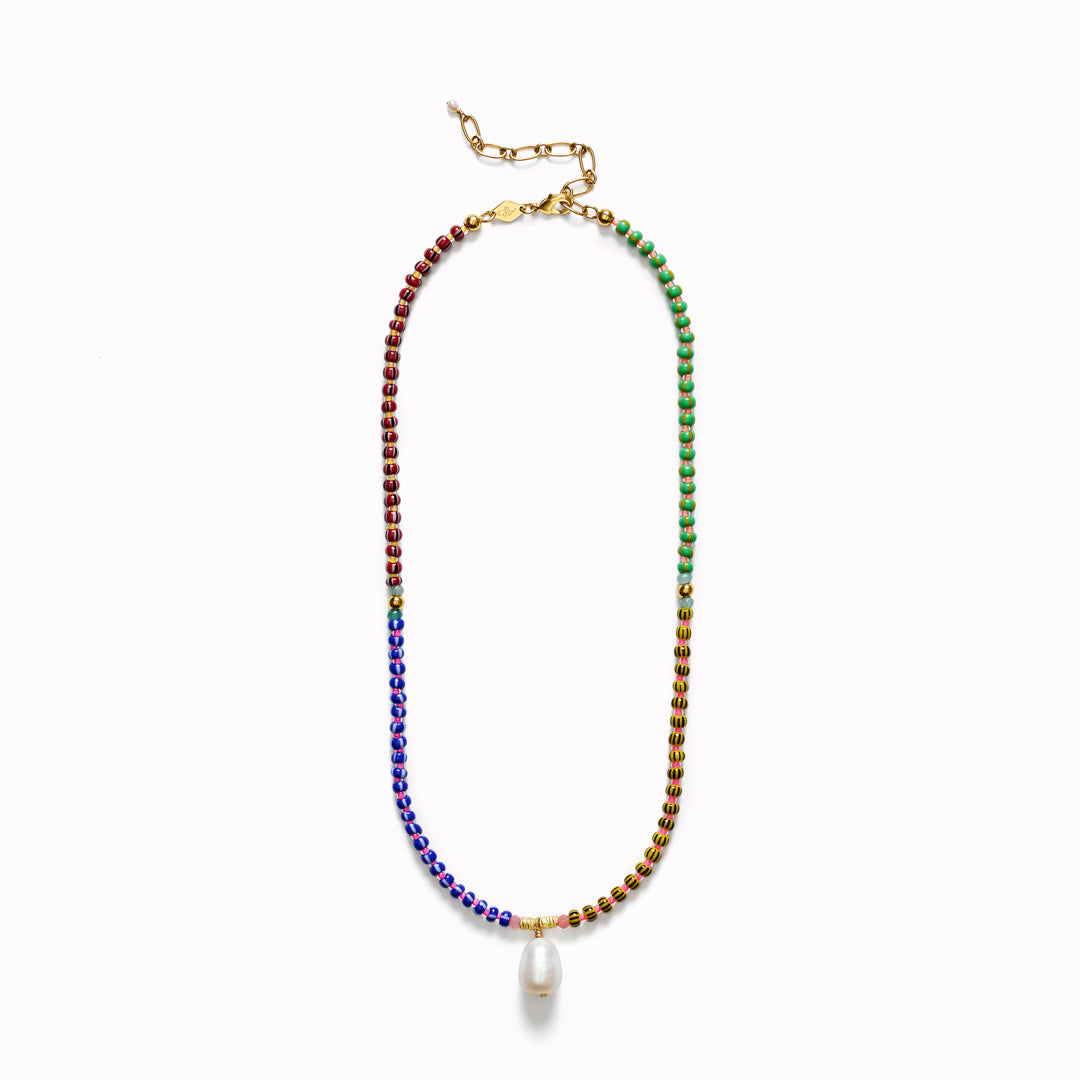 The Anni Lu Magic Moments necklace is a bold and colourful glass beaded necklace with a cultured freshwater pearl pendant charm detail