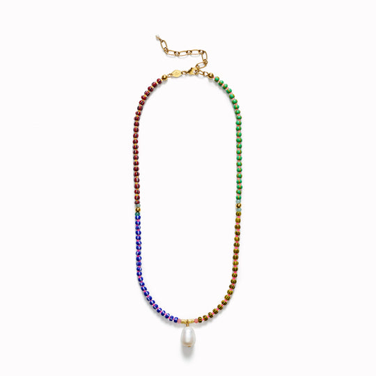 The Anni Lu Magic Moments necklace is a bold and colourful glass beaded necklace with a cultured freshwater pearl pendant charm detail