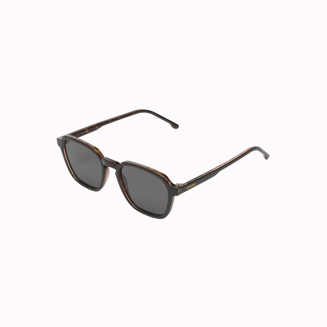 Side view. The Matty is an elegant frame with rectangular shaped lenses, and is a great shape to fit all kinds of faces. The frame is measured at a Medium size. These sunglasses are unisex, so are suitable for both men and women.  With a striking black frame edged with tortoiseshell, the Matty Black Tortoise is both modern and classic. A great look.