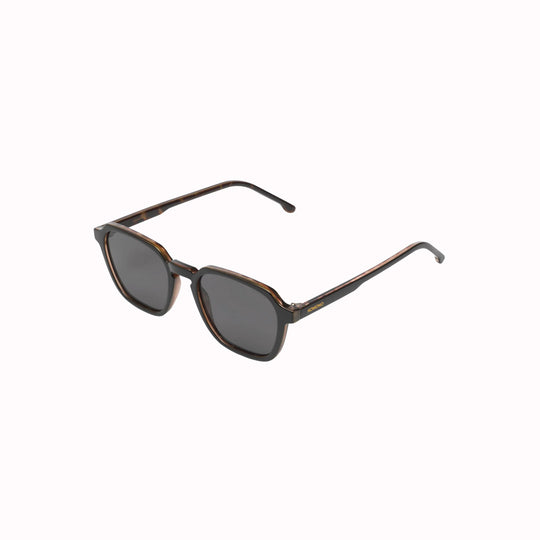 Side view. The Matty is an elegant frame with rectangular shaped lenses, and is a great shape to fit all kinds of faces. The frame is measured at a Medium size. These sunglasses are unisex, so are suitable for both men and women.  With a striking black frame edged with tortoiseshell, the Matty Black Tortoise is both modern and classic. A great look.