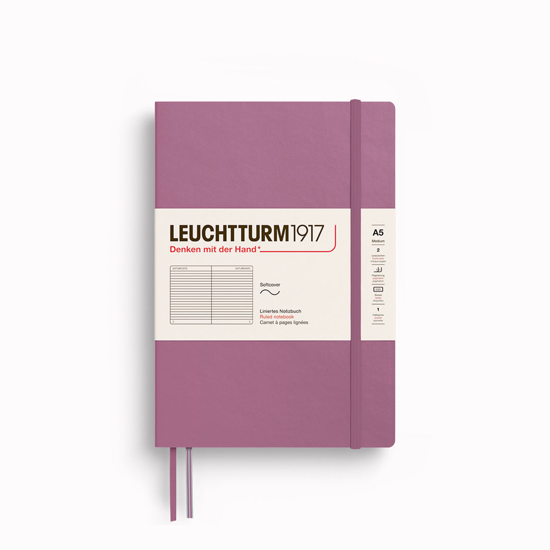 The A5 Lined Medium Notebook features 2 page markers, a blank table of contents, numbered pages, a gusseted pocket for loose notes and business cards, an elastic enclosure band