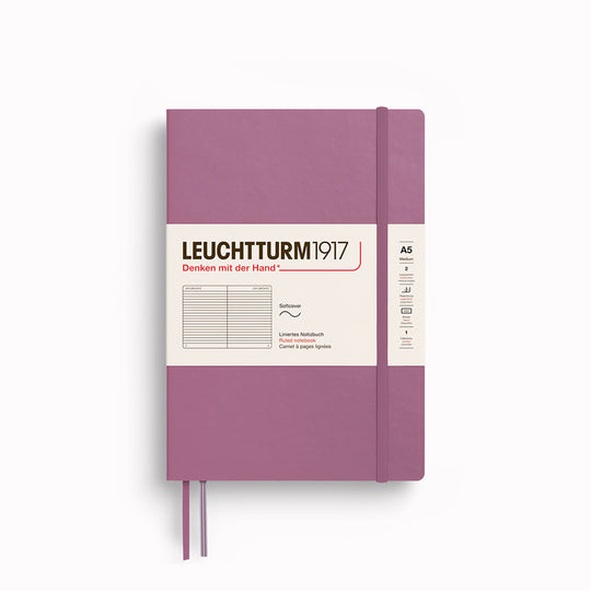 The A5 Lined Medium Notebook features 2 page markers, a blank table of contents, numbered pages, a gusseted pocket for loose notes and business cards, an elastic enclosure band