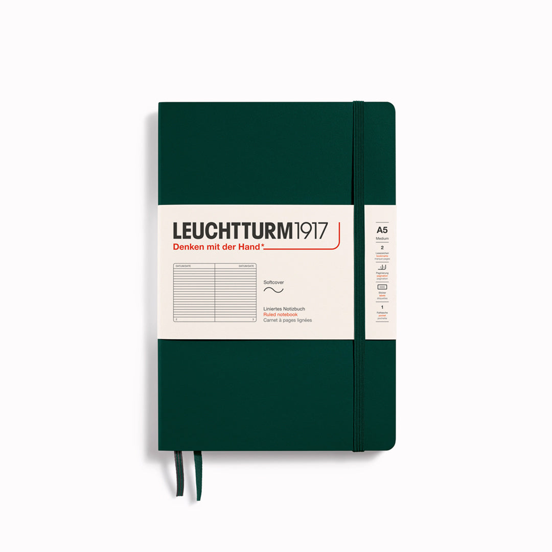 The A5 Lined Medium Notebook features 2 page markers, a blank table of contents, numbered pages, a gusseted pocket for loose notes and business cards, an elastic enclosure band