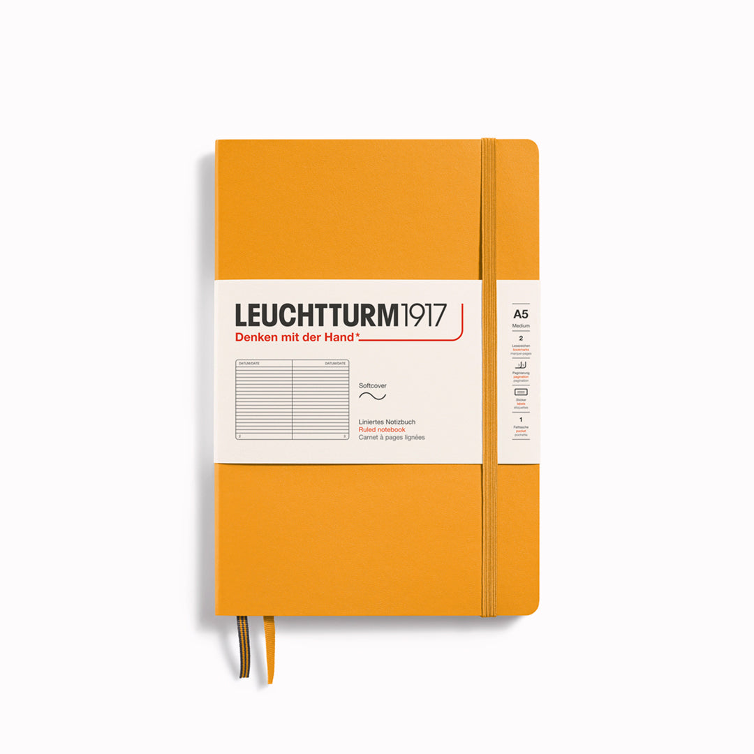 The A5 Lined Medium Notebook features 2 page markers, a blank table of contents, numbered pages, a gusseted pocket for loose notes and business cards, an elastic enclosure band