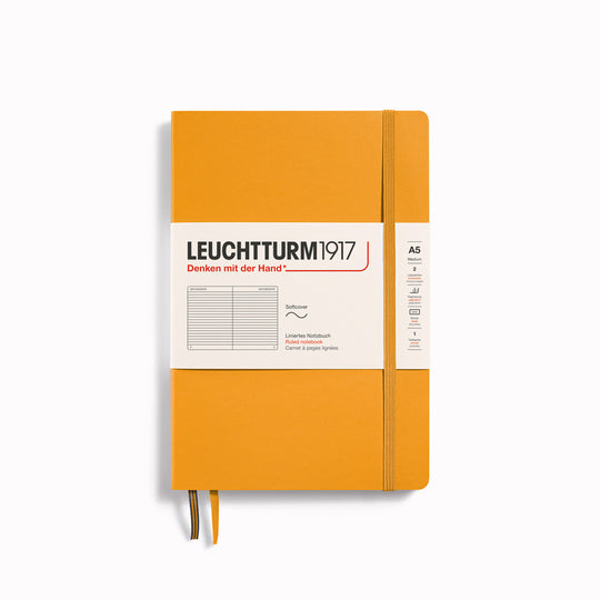 The A5 Lined Medium Notebook features 2 page markers, a blank table of contents, numbered pages, a gusseted pocket for loose notes and business cards, an elastic enclosure band
