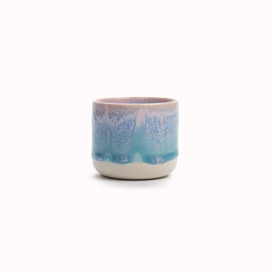 The pale blue over pink glaze Miami Sip Cup - Danish/Japanese mix up with this thick glazed, hand made ceramic small beaker from Studio Arhoj's Tokyo Series.