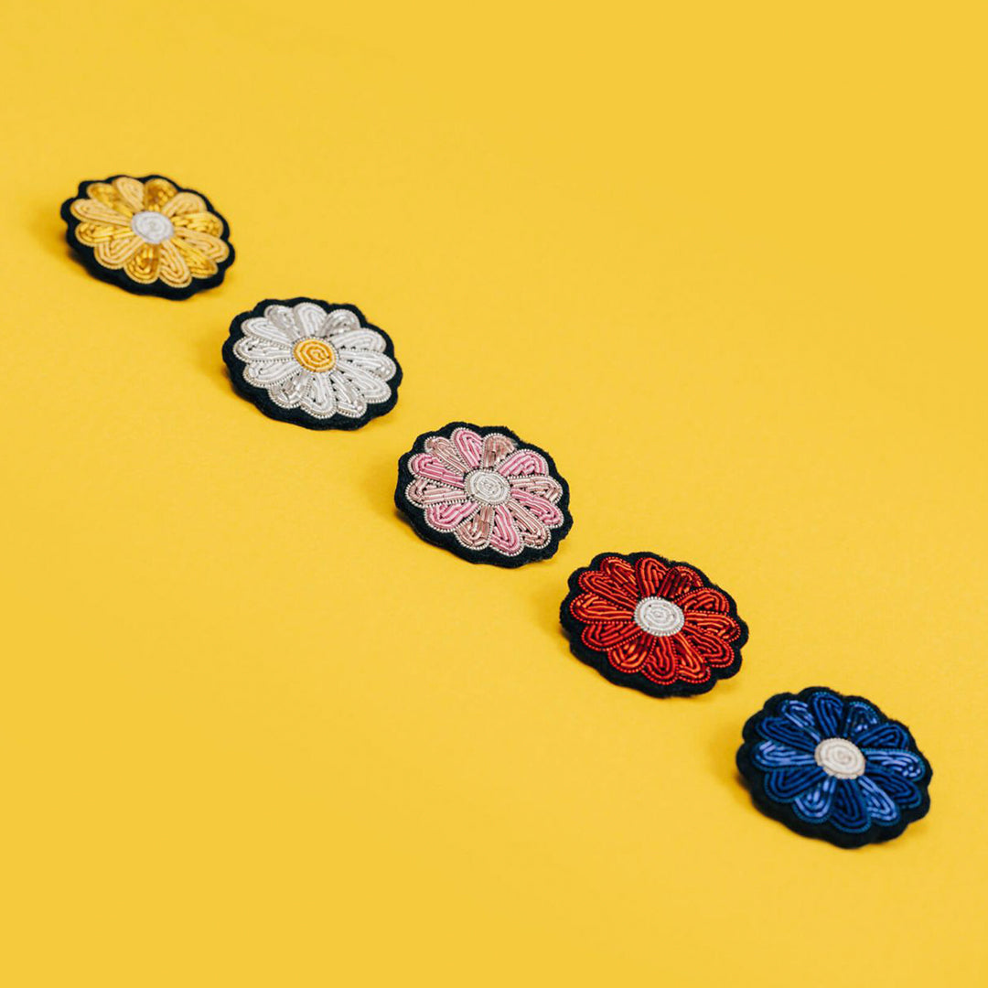 Hand-embroidered Mini Daisy lapel pin by Parisian fashion accessory brand Macon et Lesquoy. Measuring approximately 30mm by 30mm, the mini daisy brooch is part of their 'Timeless Creations' Collection