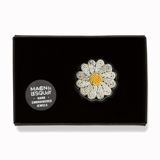 Hand-embroidered Mini Daisy lapel pin by Parisian fashion accessory brand Macon et Lesquoy. Measuring approximately 30mm by 30mm, the mini daisy brooch is part of their 'Timeless Creations' Collection