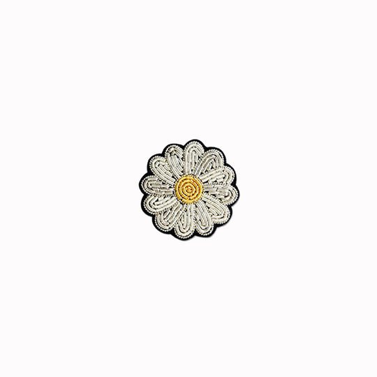 Hand-embroidered Mini Daisy lapel pin by Parisian fashion accessory brand Macon et Lesquoy. Measuring approximately 30mm by 30mm, the mini daisy brooch is part of their 'Timeless Creations' Collection