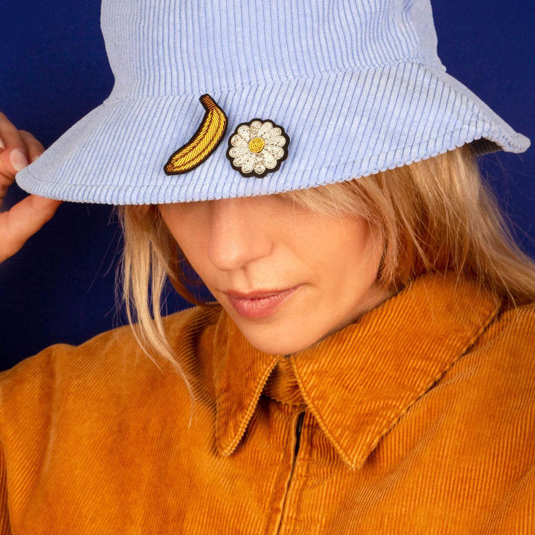 Hand-embroidered Mini Daisy lapel pin by Parisian fashion accessory brand Macon et Lesquoy. Measuring approximately 30mm by 30mm, the mini daisy brooch is part of their 'Timeless Creations' Collection