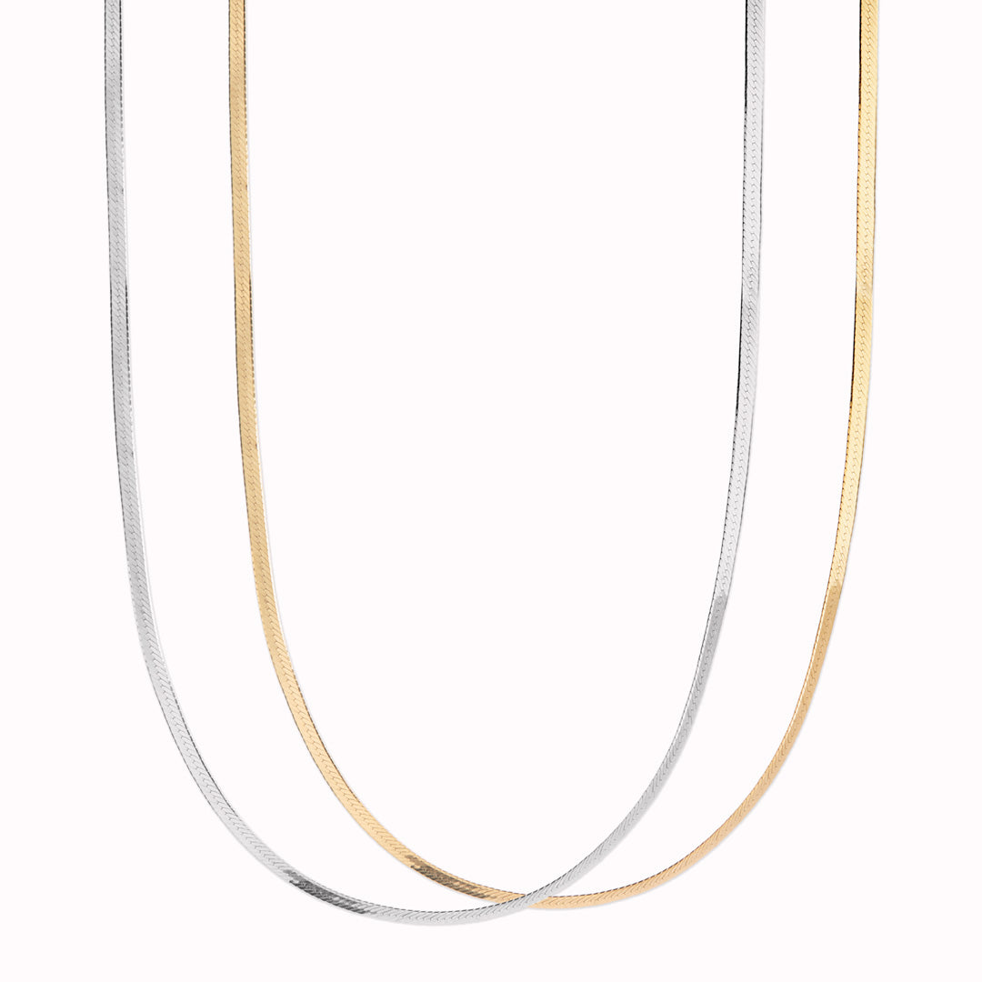 Mio Chain from Maria Black. Its sinuous, snake-like chain design drapes gracefully around the neck, creating a captivating visual statement. The adjustable length ensures a comfortable fit, allowing you to personalize your style.