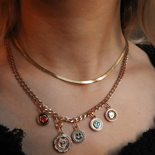 Mio Chain in Gold. Its sinuous, snake-like chain design drapes gracefully around the neck, creating a captivating visual statement. The adjustable length ensures a comfortable fit, allowing you to personalize your style. As Worn.