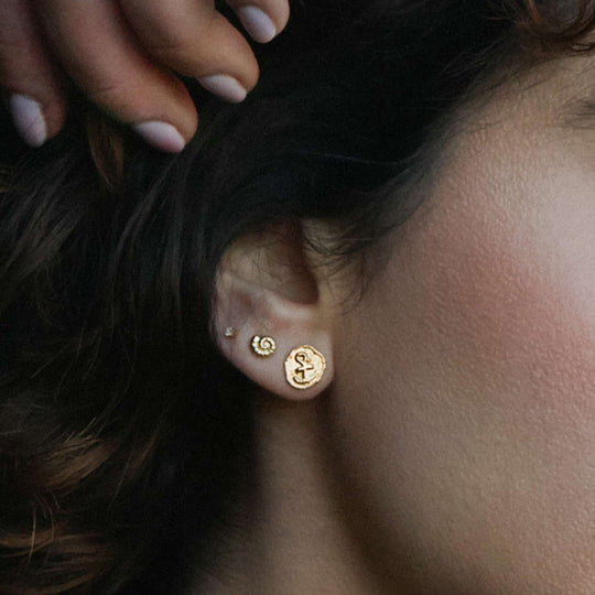 The Mudlarked Anchor Token Stud Earrings are available in 22ct gold plated silver or sterling silver stud earrings.