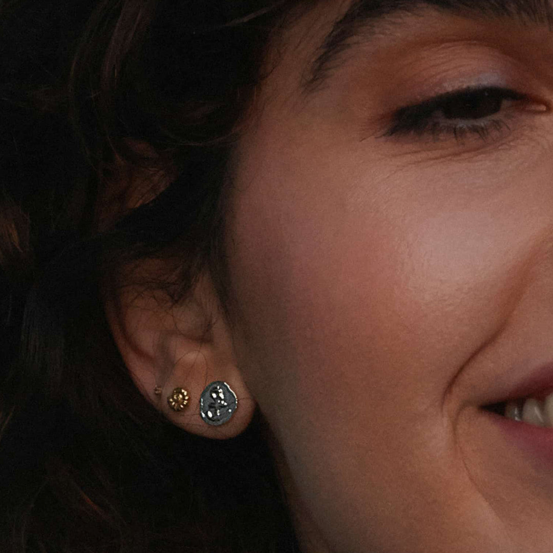 The Mudlarked Anchor Token Stud Earrings are available in 22ct gold plated silver or sterling silver stud earrings.