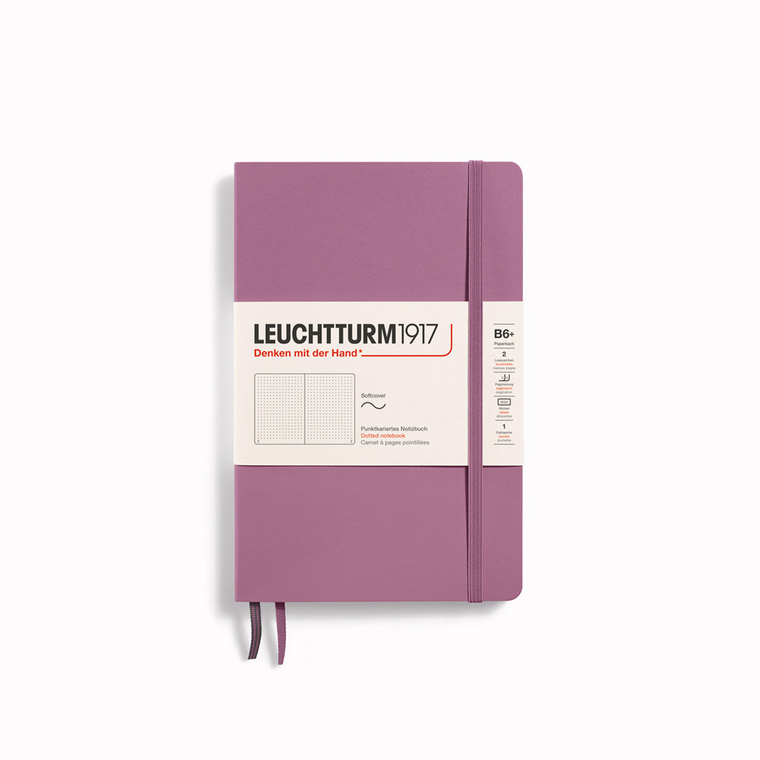 The B6+ Softcover Dotted Notebook features 2 page markers, a blank table of contents, numbered pages, a gusseted pocket for loose notes and business cards, an elastic enclosure band